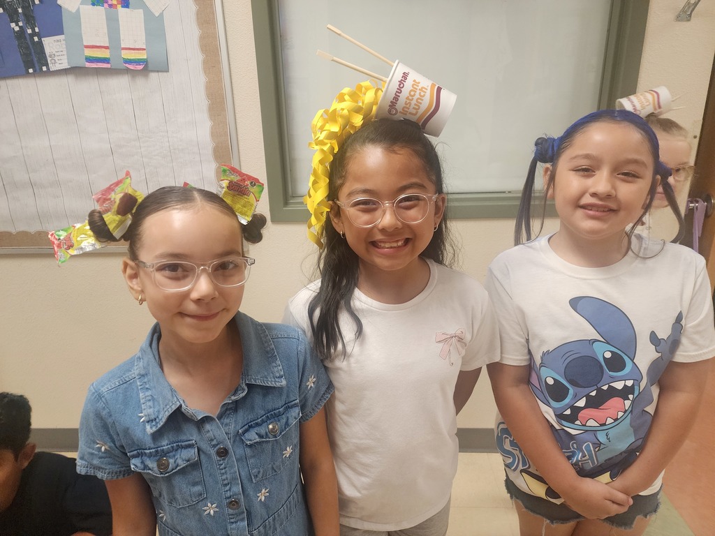 3 girls displaying their fun hairstyles for Crazy Hair Day