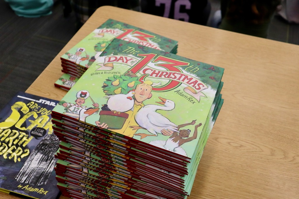Adam Rex stacks of books titled the 13th day of christmas