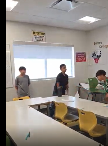 Students passing a ball. 