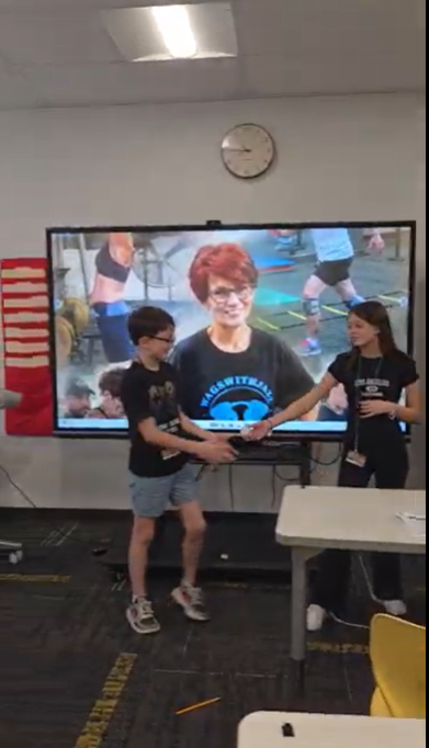 Students passing a ball. 