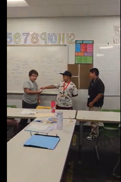 Students passing a ball. 