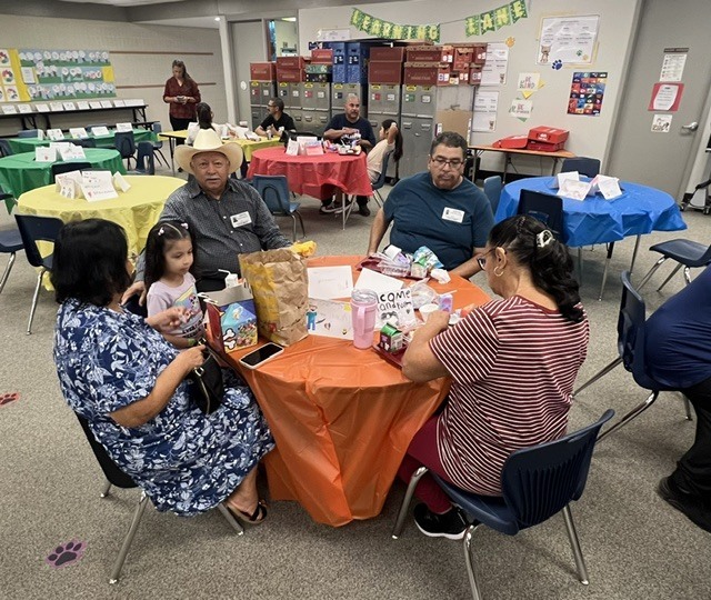 Students eating lunch with their grandparents.