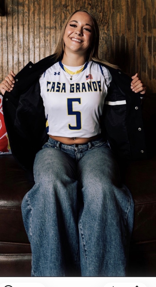 girl in jersey and jacket posing