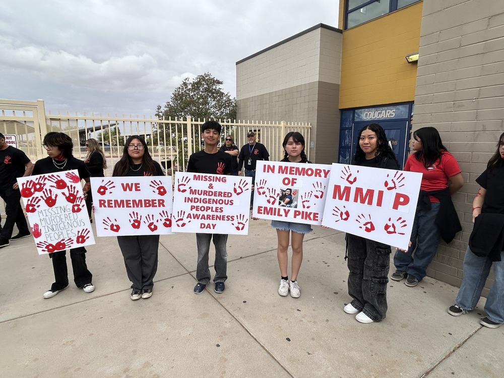 Students holding Missing & Murdered Indigenous People signs