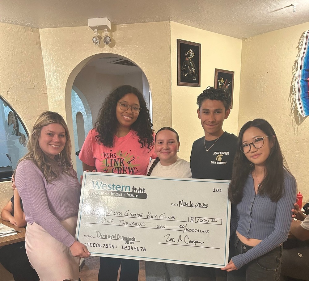 Key Club accepting donation check