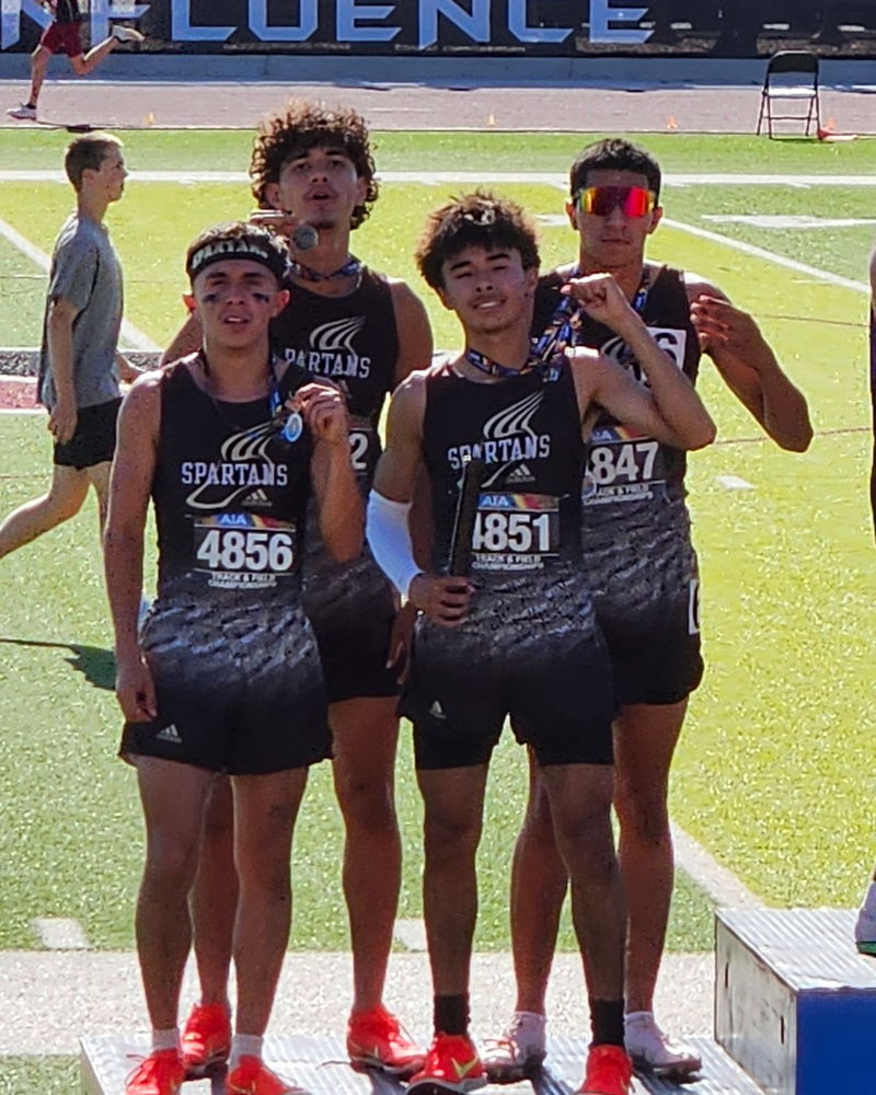 Boys 4x8 on podium with medals