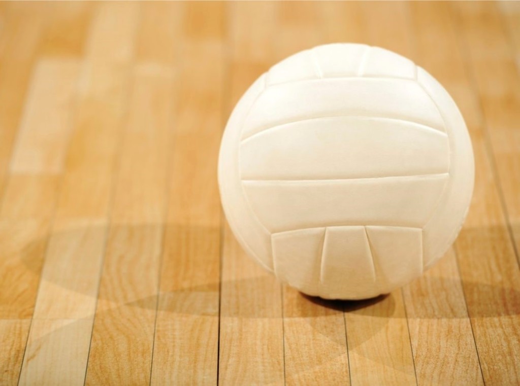 a volleyball on a gym floor