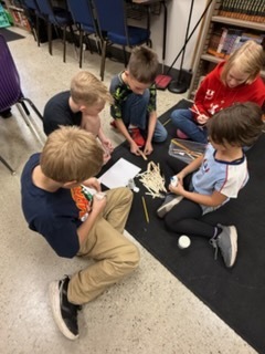 Students completing a design challenge