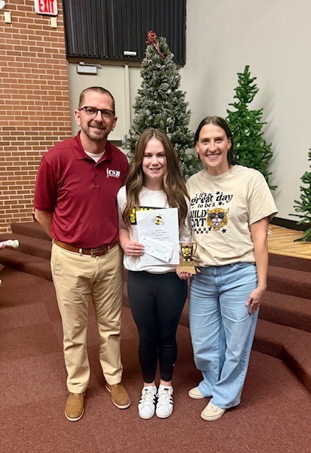 Bri Hudson, Spelling Bee Winner pictured with Chad Tichnor, Community State Bank and Rebecca Drury, Cashion PTO