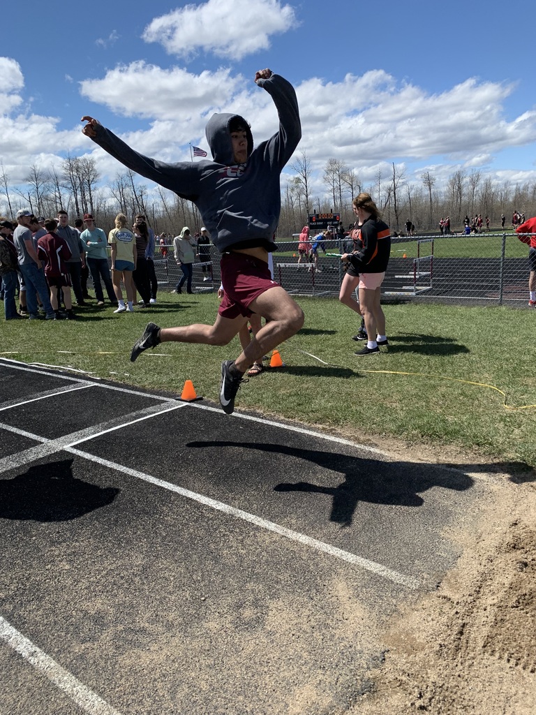 Boy doing a long jump