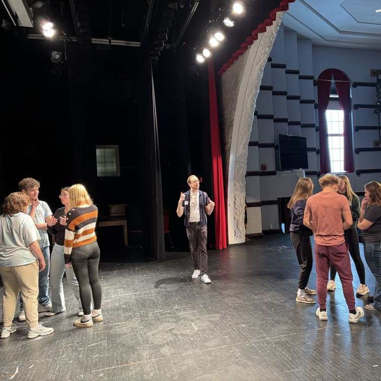 The separate groups brainstorming the act they are going to display!