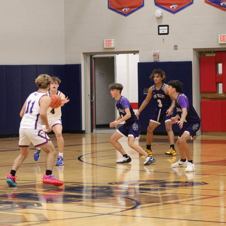 Brody Hawkins passing Cameron Katilus the ball