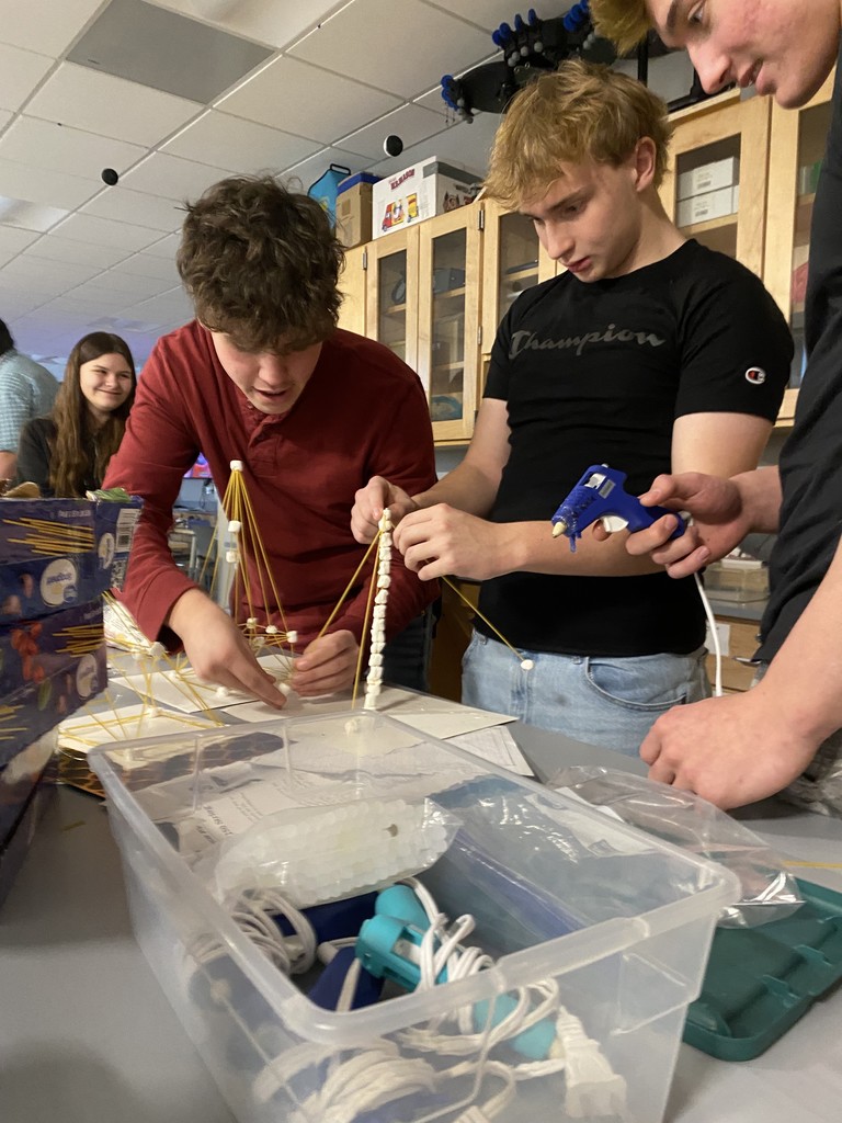 Students creating pasta towers