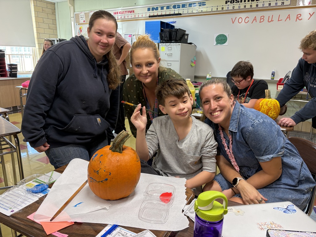 Key Club - students painting pumpkins in class