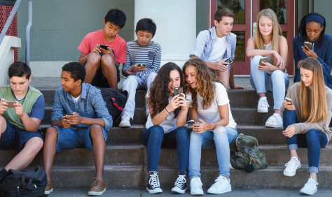 teenagers with cell phones