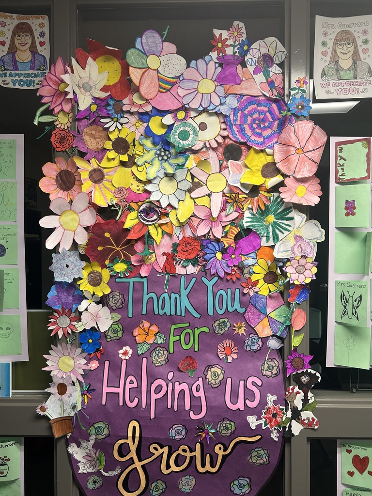 Paper flower in a vase that says Thank you for helping us grow