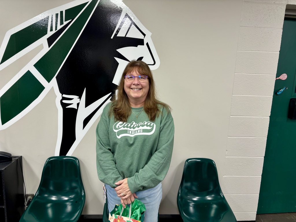 Mrs. Guerrero posing with her gift fro school counselor week