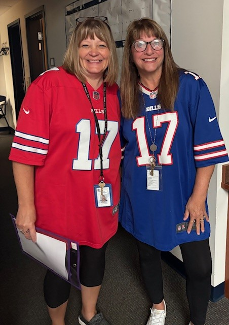 2 Staff members wearing Bills jerseys