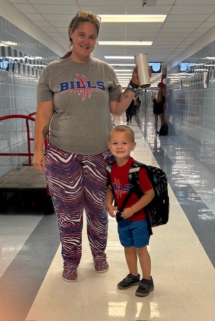 Staff member and son in Bills gear
