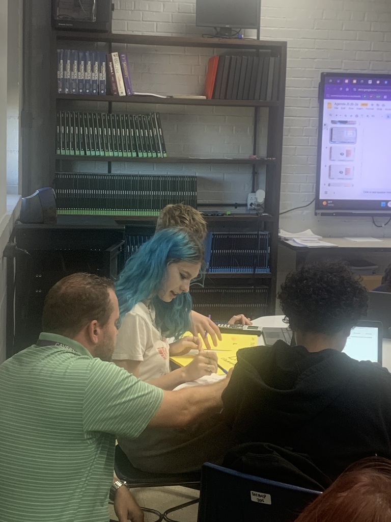 Mr. Shimp helping a CHS student with their math.