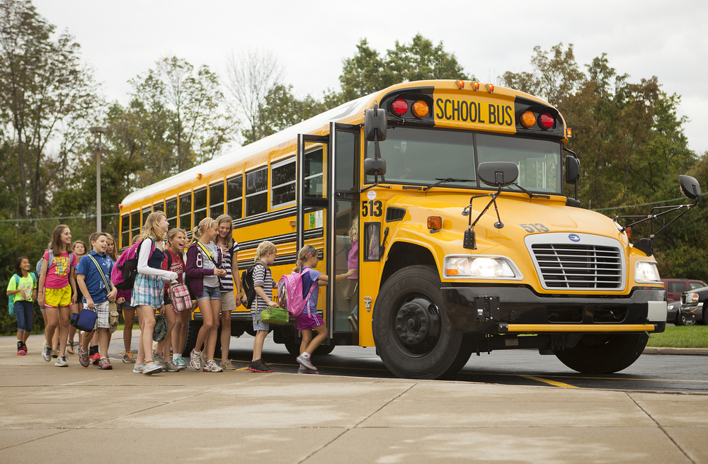 Students getting on a school bus