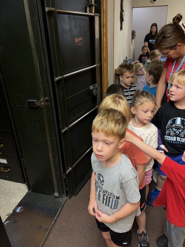 Preschool students walking in building