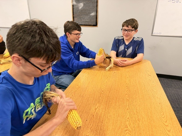 Career Development students counting kernels of corn