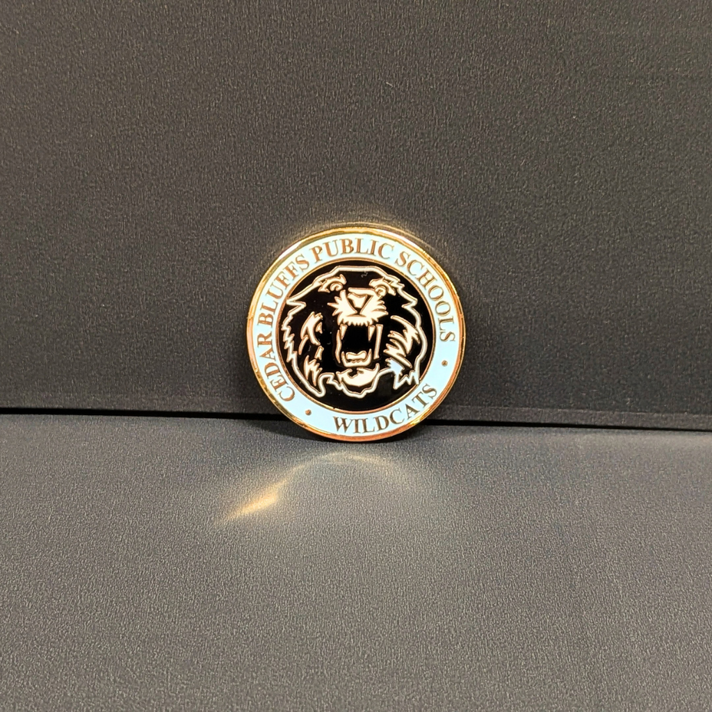 Front side of coin. Includes Wildcat logo and Cedar Bluffs Public Schools text around border.