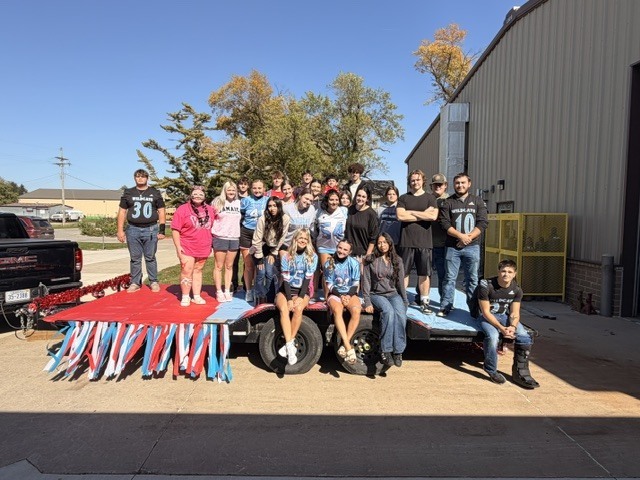 Cedar Bluffs Class of 2027 posing for picture while on float