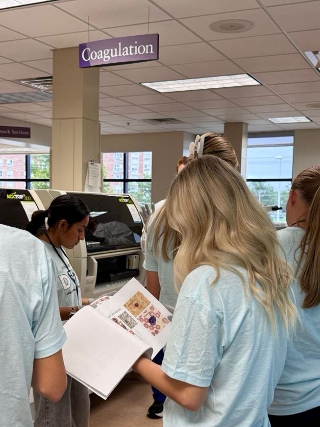 Dove Day students looking at handout