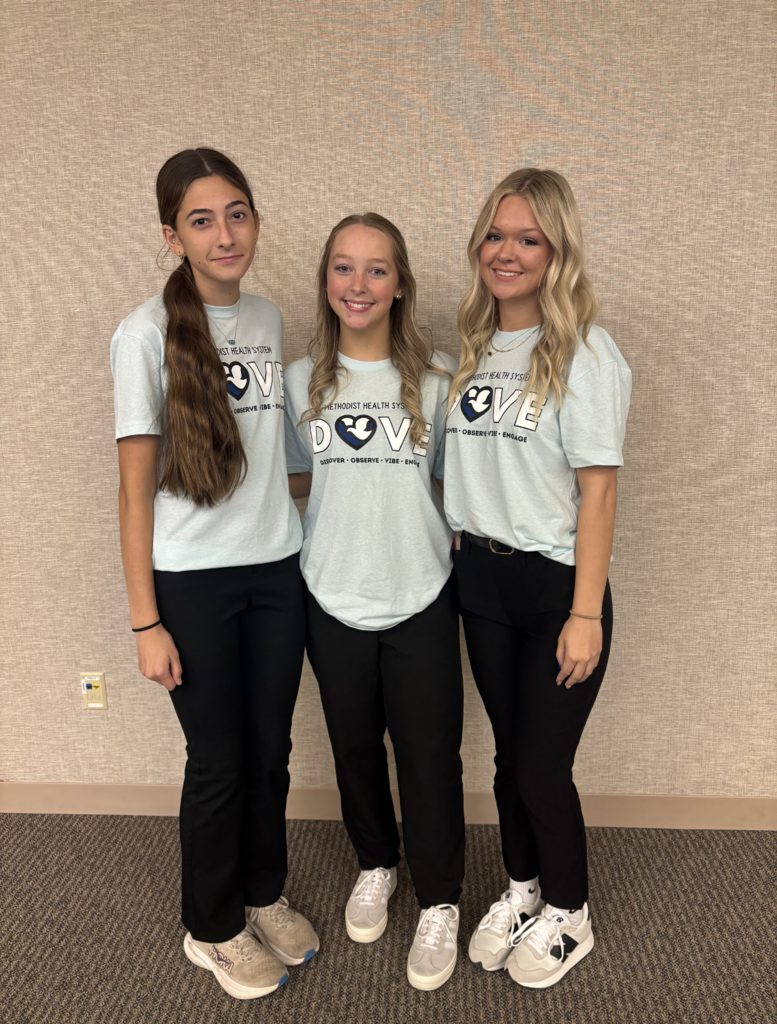 Three students dressed on Dove Day shirts