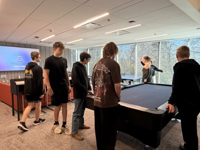 Students touring dorm recreation center