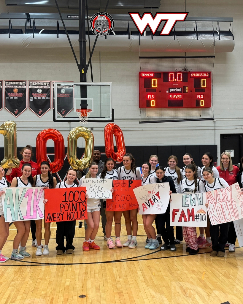 WTHS basketball players and coacjes celebrating Avery Kocur after she scored over 1000 career points