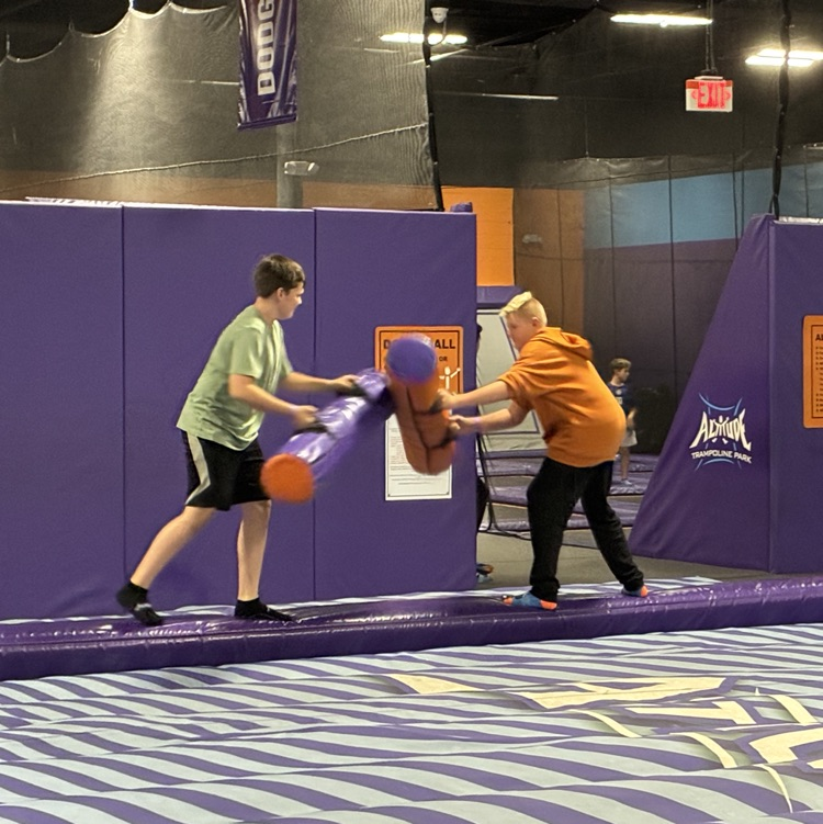 two boys jousting 