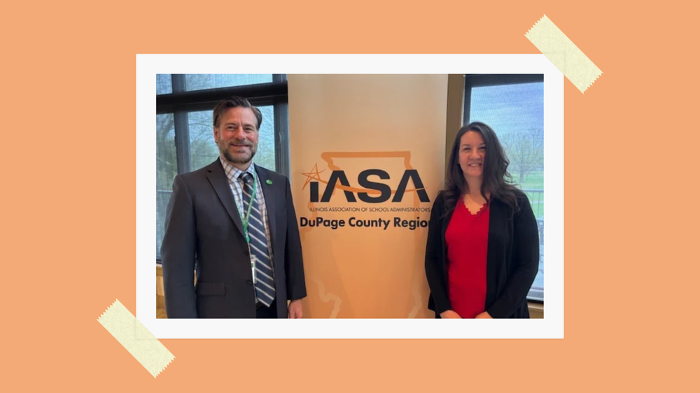 Dr. wise and robin suva in front of IASA banner