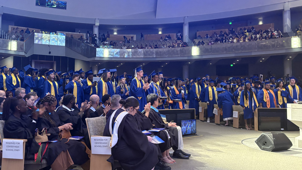 The Center High School Class of 2026  turn their tassels at graduation. 