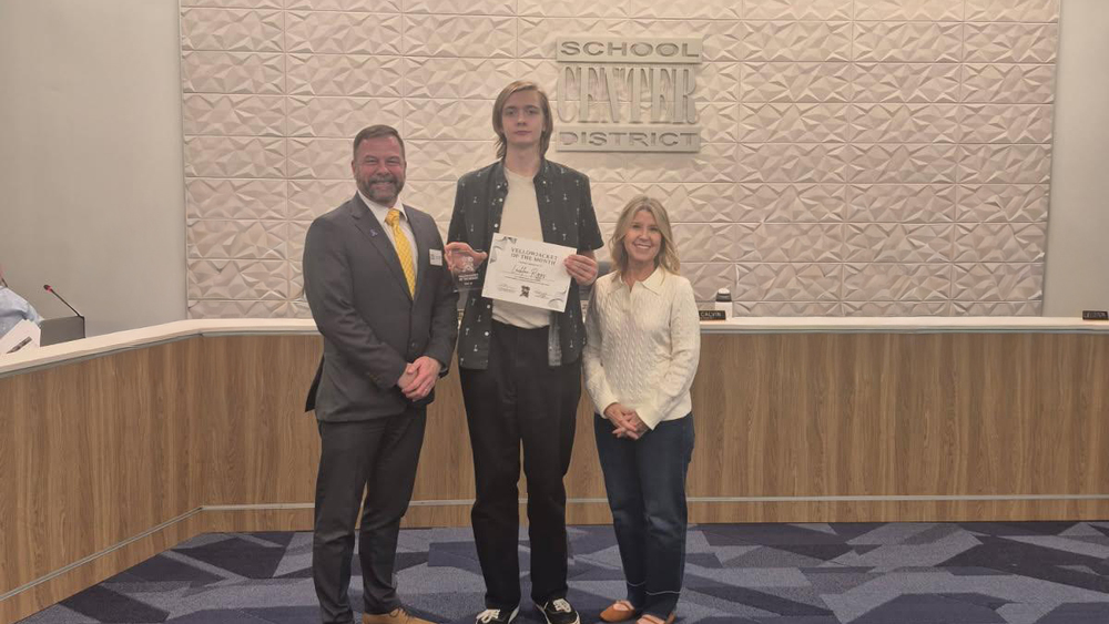 Superintendent Troy Hogg, CHS student Lachlan Riggs , and Board Chair Marcie Calvin.