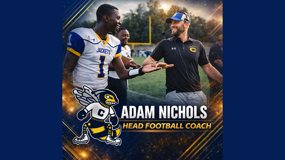 CHS Head Football Coach Adam Nichols low fives CHS football player in #1 jersey.