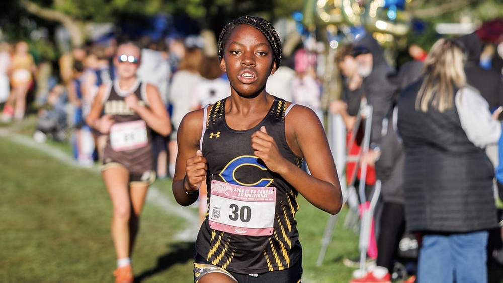 CHS Senior Makenzie Berg runs toward the finish line at a Cross Country meet.