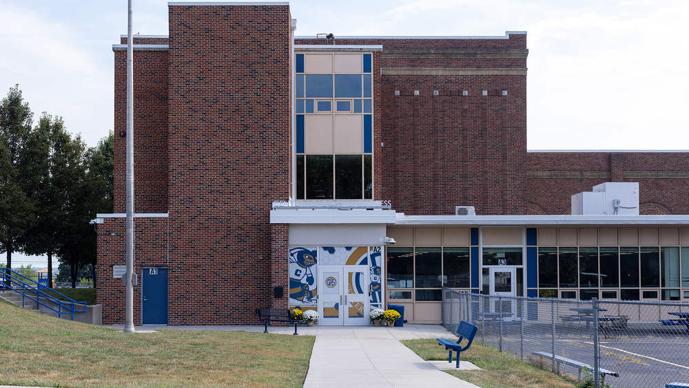 Center Academy for Success, a brick building with a yellowjacket decal next to the front door.
