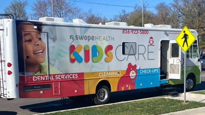 Swope Kids Care bus is parked outside Yellowjacket Early Learning Center.