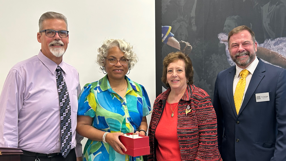 Ms. Glover is pictured  with CHS Principal Mr. Mark Wiegers, Board of Education President Cecelia Ball, and Superintendent Dr. Troy Hogg.