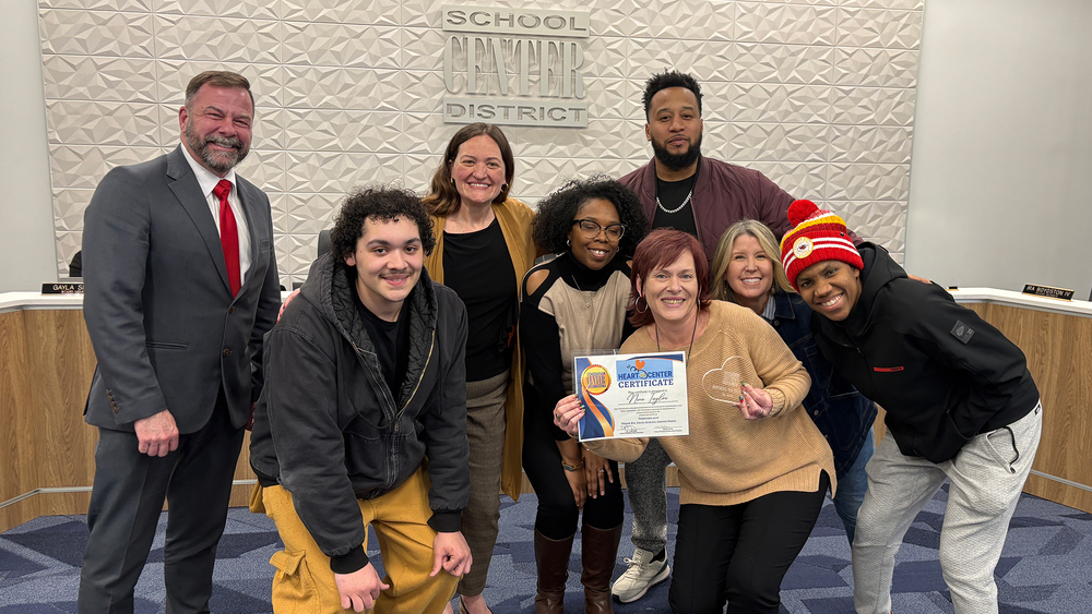 Ms. Nina Taylor and members of the Center Middle School team pose with Superintendent Troy Hogg and Board Chair Marcie Calvin.