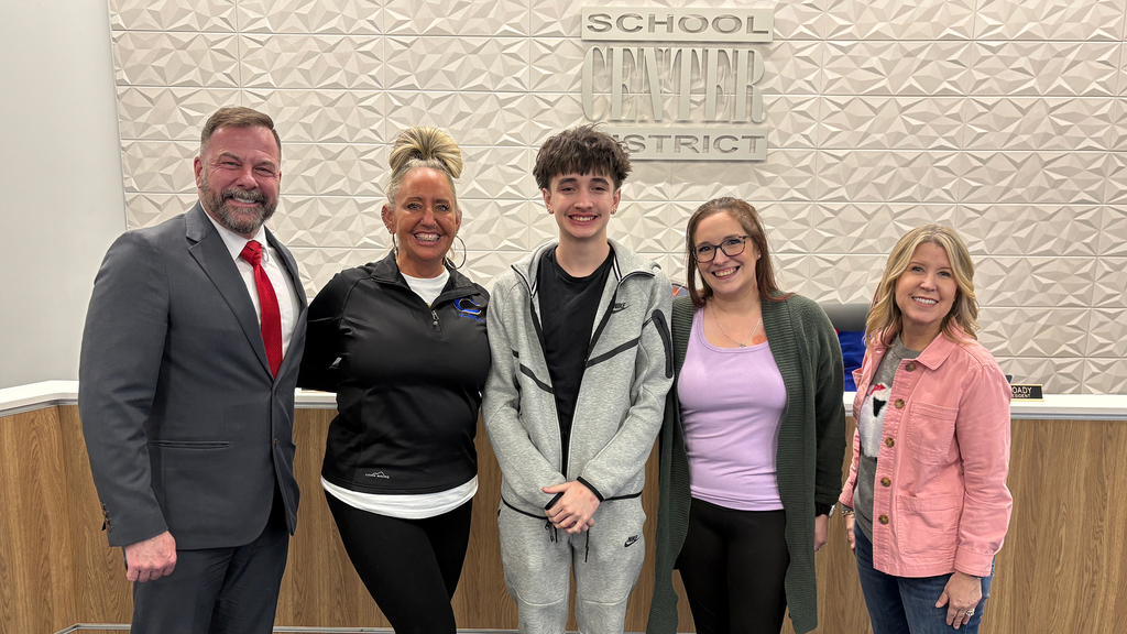 Superintendent Dr. Troy Hogg stands with Heart of Center award winner Ms. G, her student, the parent who nominated her for the award, and Board of Education Chair Marcie Calvin.
