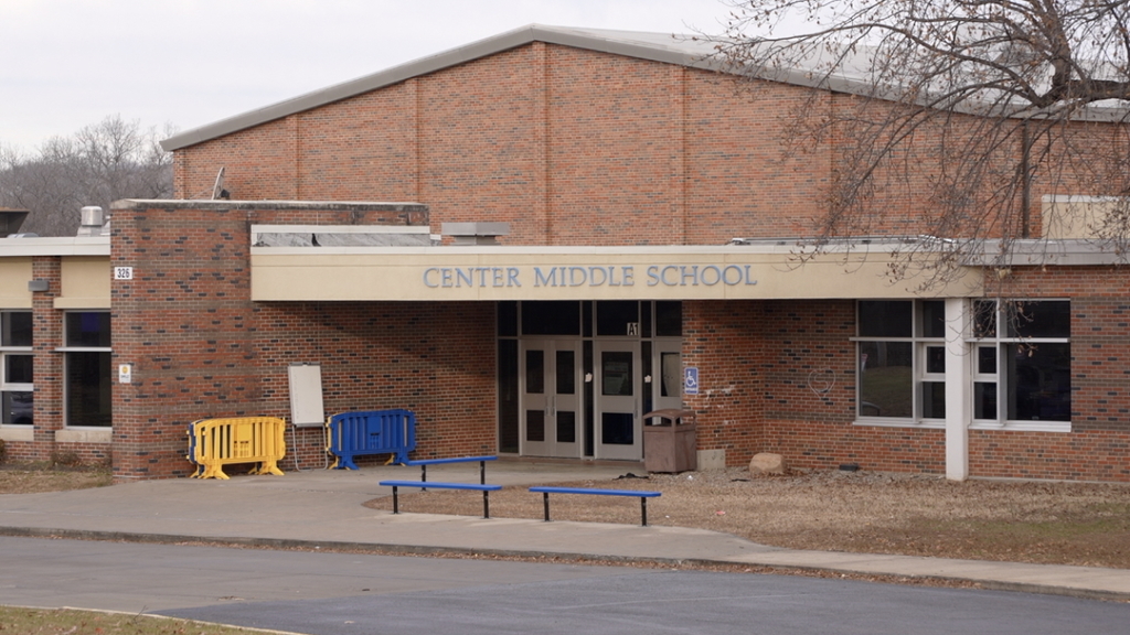 Exterior view of Center Middle School showing the main entrance and school name on the building.