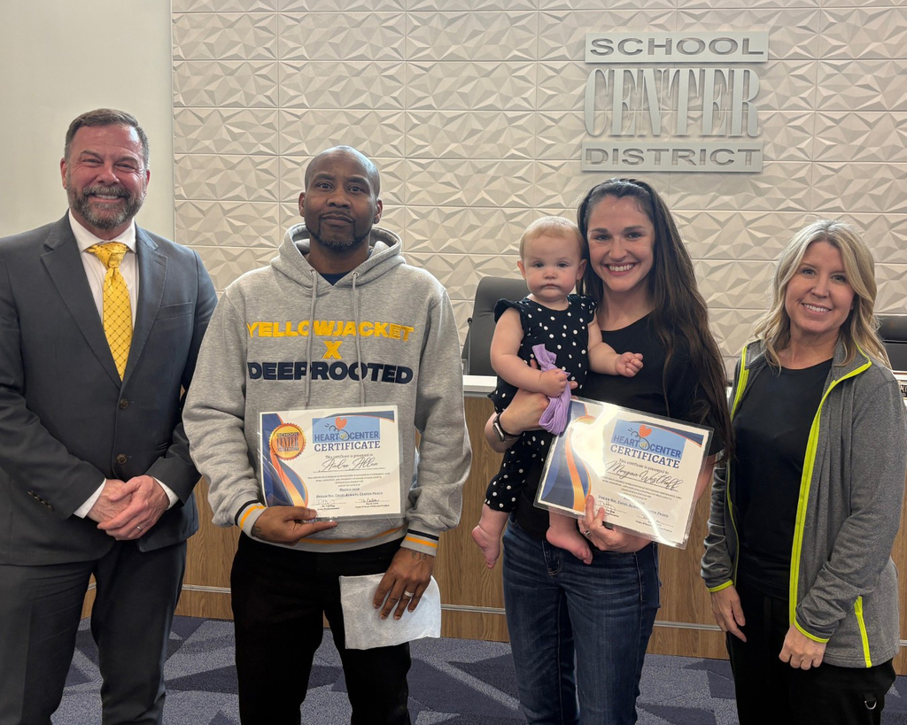March Heart of Center Honorees stand with the superintendent and board president.