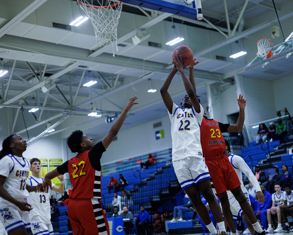 CHS basketball player shoots at basket in the gym.