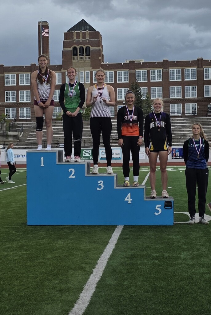 6 track athletes on a podium