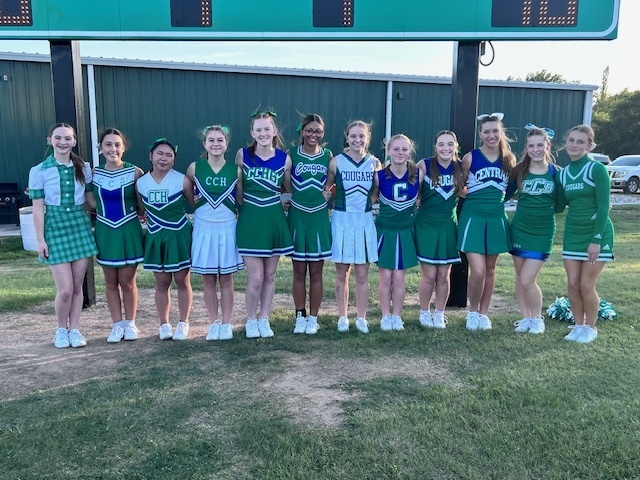 cheerleaders in decade uniforms