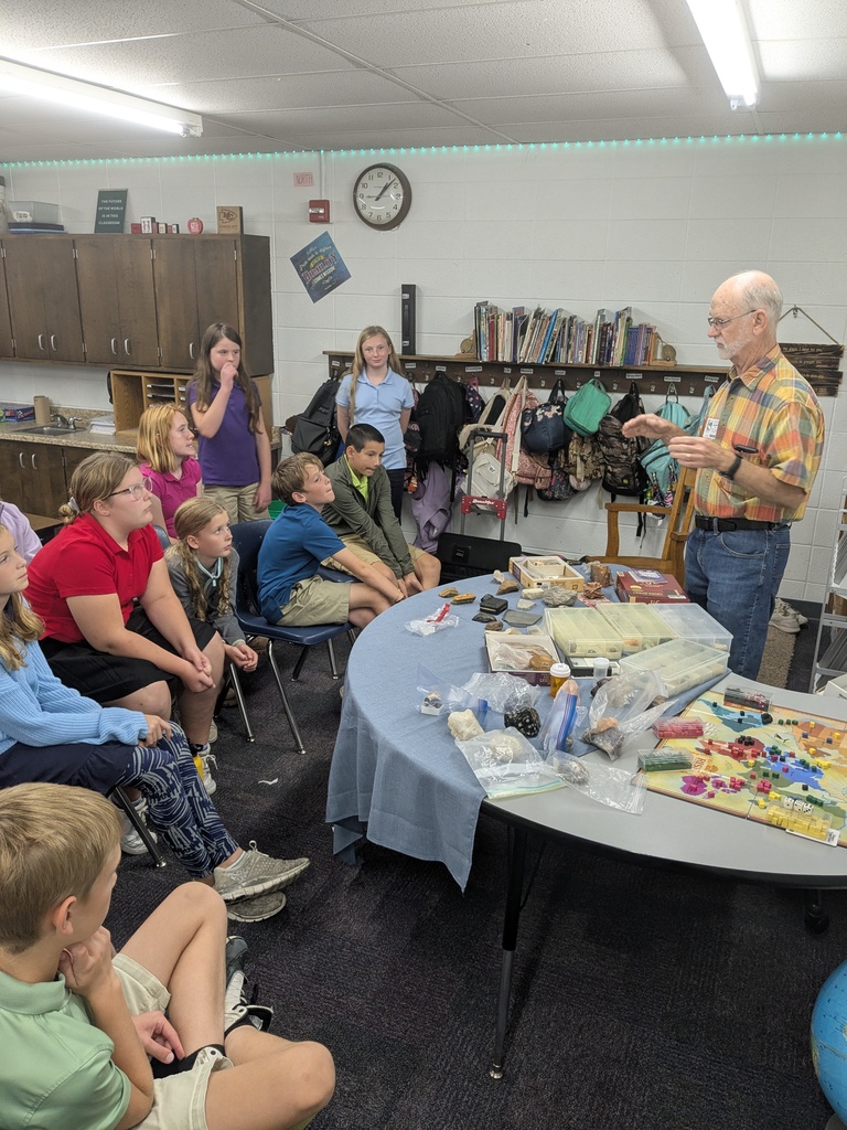 Mr. Jack Jarrott sharing his rock collection with students.